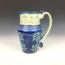 Bright and whimsical ceramic cup